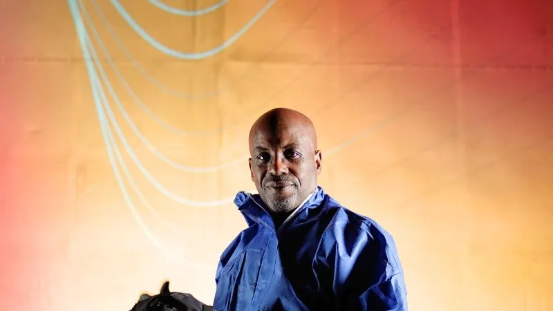 AWE male with an orange background