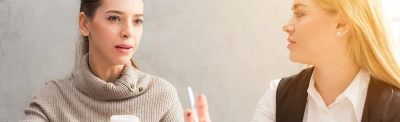 Two people sat in meeting