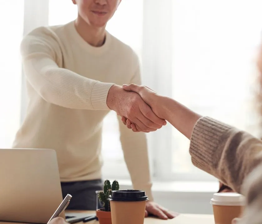 Two people shaking hands.